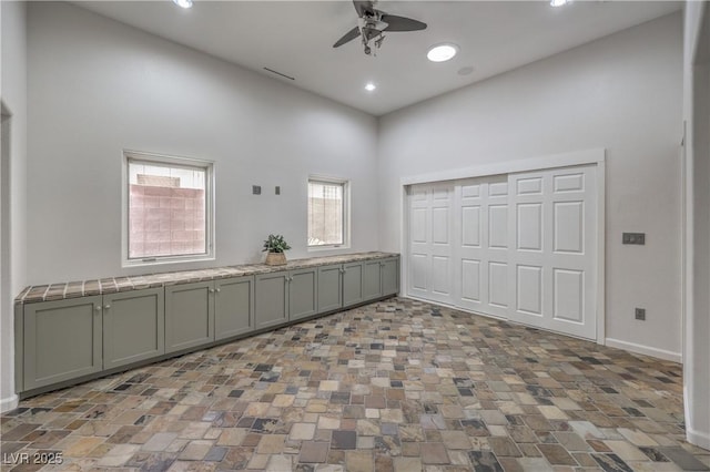 2017 Slow Wind St, Las Vegas, NV 89134 - empty room with ceiling fan, a high ceiling, and recessed lighting