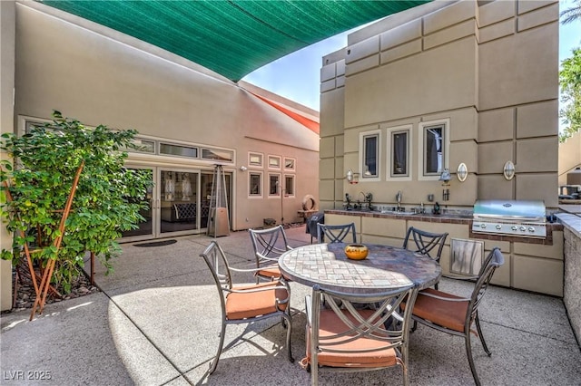 2017 Slow Wind St, Las Vegas, NV 89134 - view of patio / terrace featuring outdoor dining area and an outdoor kitchen