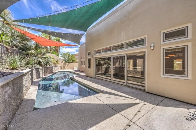 2017 Slow Wind St, Las Vegas, NV 89134 - view of swimming pool featuring a patio and a fenced backyard