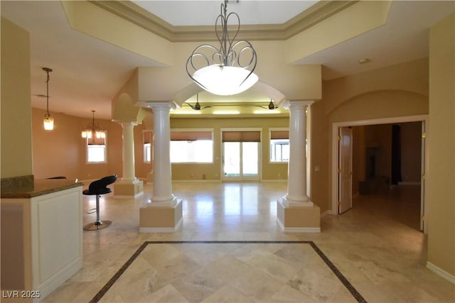 7250 Birkland Ct, Las Vegas, NV 89117 - hall with ornate columns, inlaid floor details, and crown molding
