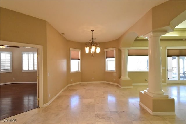 7250 Birkland Ct, Las Vegas, NV 89117 - empty room featuring decorative columns, healthy amount of natural light, a chandelier, and ceiling fan