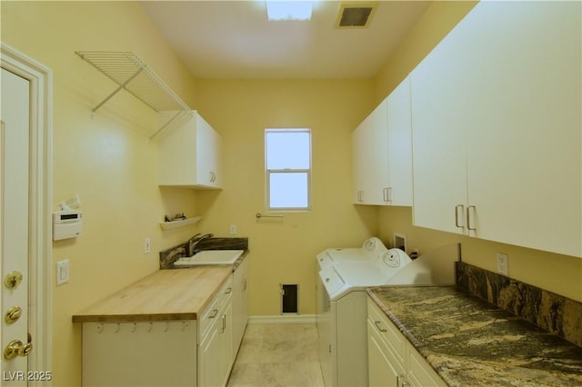 7250 Birkland Ct, Las Vegas, NV 89117 - laundry area featuring cabinet space and separate washer and dryer