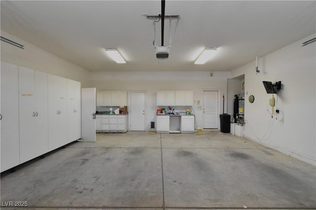 7250 Birkland Ct, Las Vegas, NV 89117 - garage with washing machine and dryer and a garage door opener