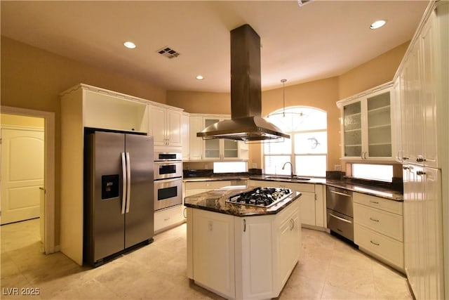 7250 Birkland Ct, Las Vegas, NV 89117 - kitchen with stainless steel appliances, island range hood, glass insert cabinets, white cabinets, and a kitchen island