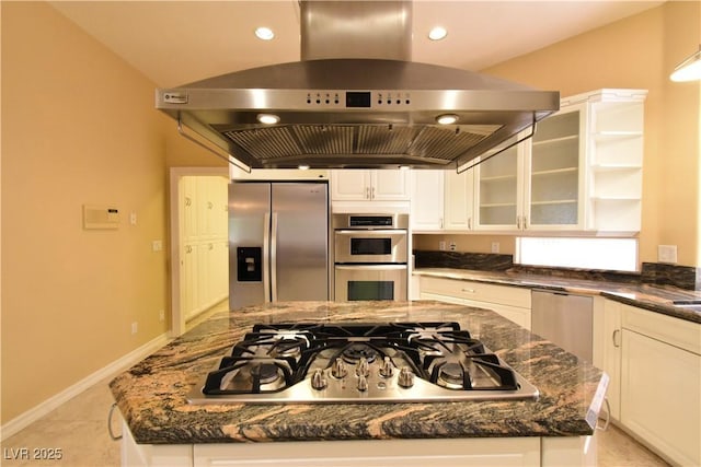 7250 Birkland Ct, Las Vegas, NV 89117 - kitchen with wall chimney range hood, appliances with stainless steel finishes, a center island, dark stone counters, and recessed lighting