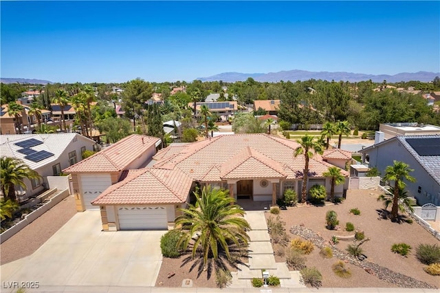 7250 Birkland Ct, Las Vegas, NV 89117 - view of front of house with a garage, a tiled roof, driveway, and stucco siding