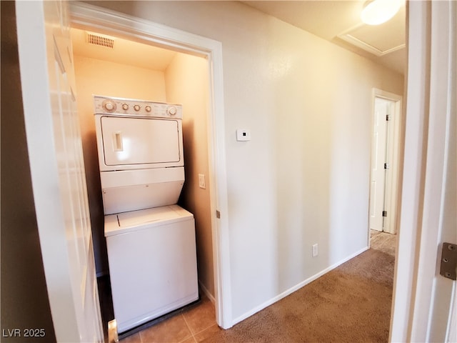 9069 Tantalizing Ave, Las Vegas, NV 89149 - laundry room with stacked washer / drying machine, attic access, and carpet floors