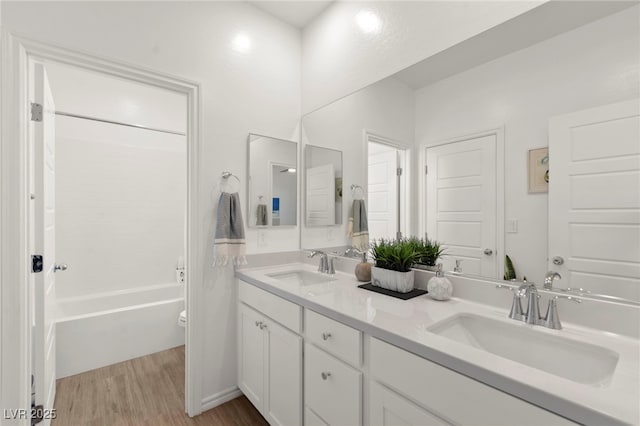 9743 Mojave Mountain St, Las Vegas, NV 89166 - full bath with wood finished floors, double vanity, and washtub / shower combination