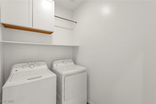 9743 Mojave Mountain St, Las Vegas, NV 89166 - laundry area with cabinet space and separate washer and dryer