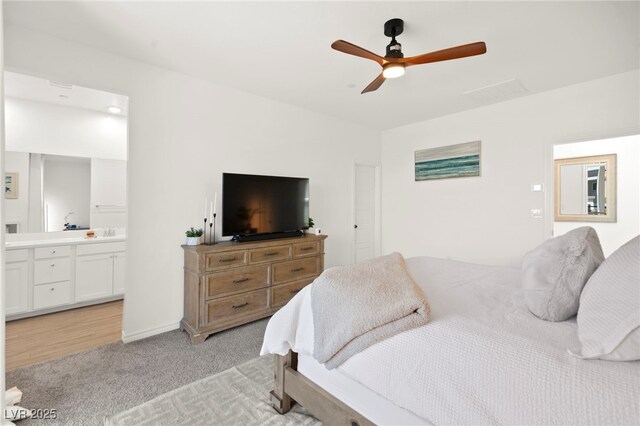 9743 Mojave Mountain St, Las Vegas, NV 89166 - bedroom with light carpet, ensuite bathroom, and a ceiling fan