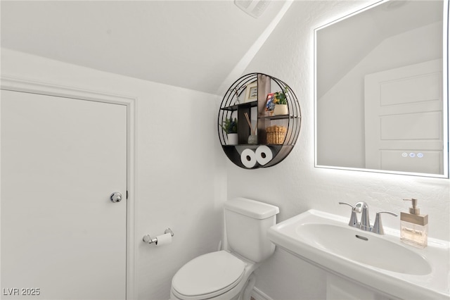 9743 Mojave Mountain St, Las Vegas, NV 89166 - bathroom with vaulted ceiling and a sink