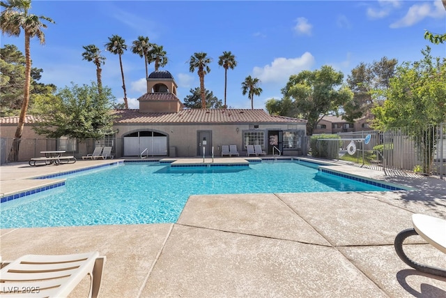 220 Mission Catalina Ln Unit 208, Las Vegas, NV 89107 - community pool featuring a patio
