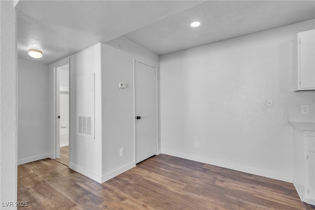 220 Mission Catalina Ln Unit 208, Las Vegas, NV 89107 - basement with wood finished floors, recessed lighting, and a textured ceiling