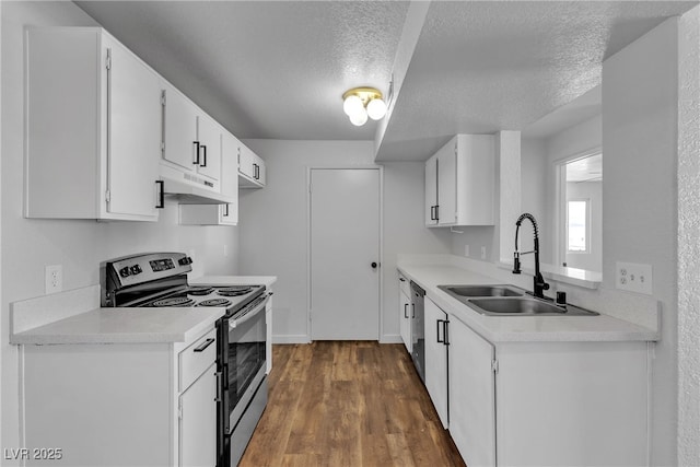 220 Mission Catalina Ln Unit 208, Las Vegas, NV 89107 - kitchen with stainless steel range with electric stovetop, under cabinet range hood, a textured ceiling, light countertops, and dark wood-style flooring