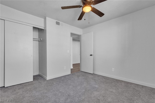 220 Mission Catalina Ln Unit 208, Las Vegas, NV 89107 - unfurnished bedroom featuring carpet, a closet, and ceiling fan