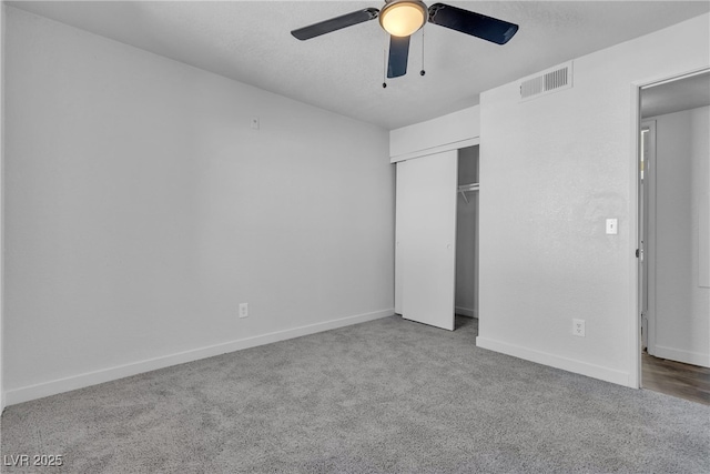 220 Mission Catalina Ln Unit 208, Las Vegas, NV 89107 - unfurnished bedroom featuring carpet flooring, a closet, and a ceiling fan
