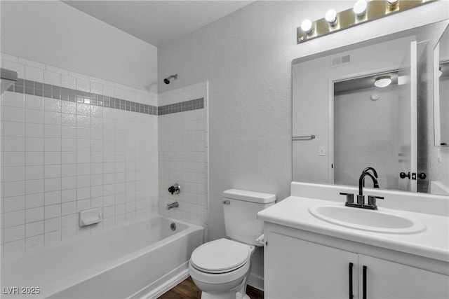 220 Mission Catalina Ln Unit 208, Las Vegas, NV 89107 - full bath featuring vanity, washtub / shower combination, wood finished floors, and a textured wall
