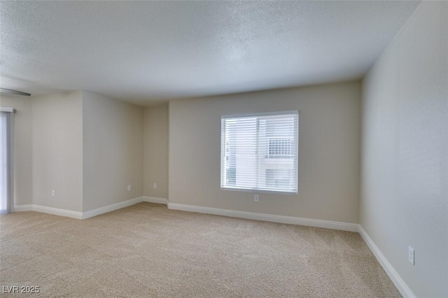 6800 E Lake Mead Blvd Unit 2072, Las Vegas, NV 89156 - unfurnished room featuring light colored carpet and a textured ceiling