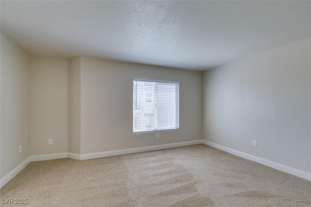 6800 E Lake Mead Blvd Unit 2072, Las Vegas, NV 89156 - unfurnished room featuring light carpet and baseboards