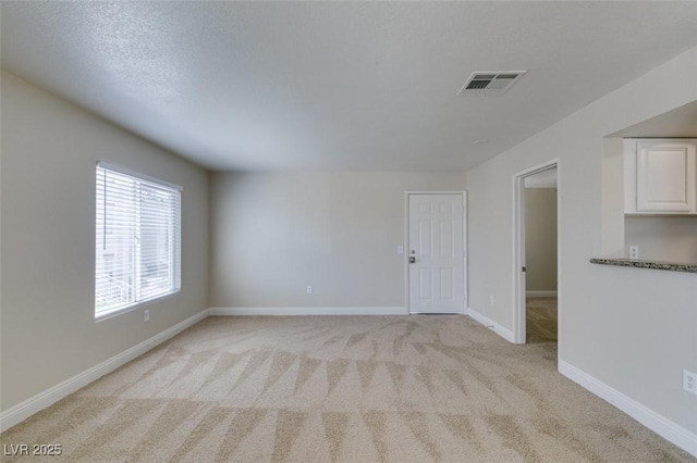 6800 E Lake Mead Blvd Unit 2072, Las Vegas, NV 89156 - spare room with light carpet and baseboards