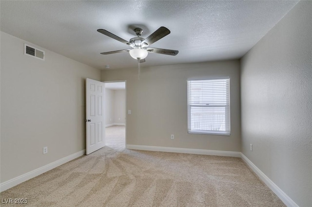 6800 E Lake Mead Blvd Unit 2072, Las Vegas, NV 89156 - empty room featuring light colored carpet, a ceiling fan, and a textured ceiling