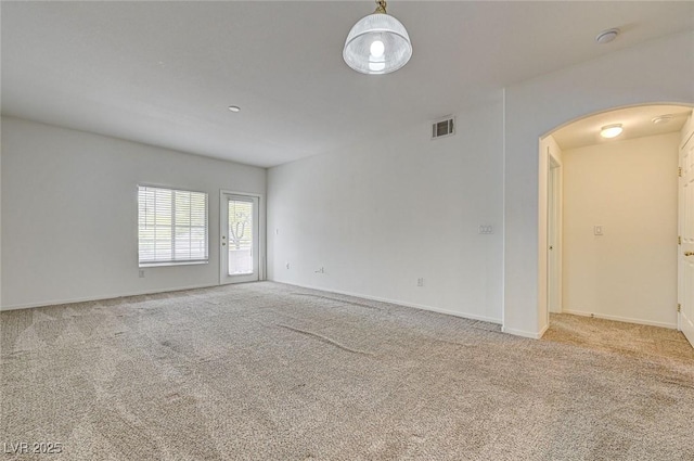 6160 Rumrill St Unit 202, Las Vegas, NV 89113 - carpeted spare room with arched walkways and baseboards