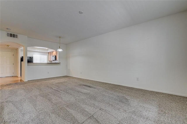 6160 Rumrill St Unit 202, Las Vegas, NV 89113 - unfurnished room with arched walkways and light carpet
