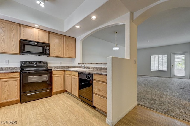 6160 Rumrill St Unit 202, Las Vegas, NV 89113 - kitchen featuring black appliances, arched walkways, recessed lighting, light wood-type flooring, and light brown cabinets