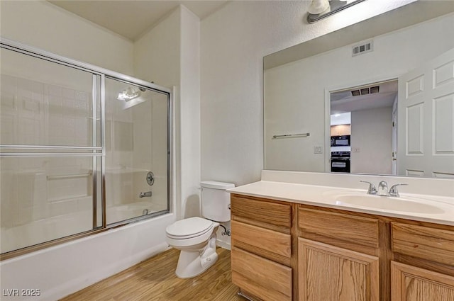 6160 Rumrill St Unit 202, Las Vegas, NV 89113 - full bath with wood finished floors, vanity, and combined bath / shower with glass door