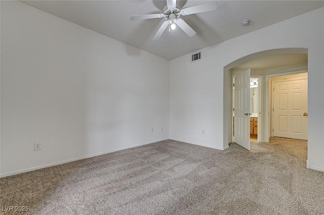 6160 Rumrill St Unit 202, Las Vegas, NV 89113 - empty room featuring arched walkways, light carpet, and a ceiling fan