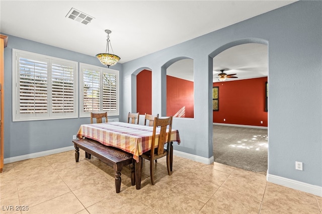 9685 Stonily Ln, Las Vegas, NV 89178 - dining area featuring arched walkways, a ceiling fan, and light tile patterned floors