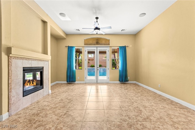 9685 Stonily Ln, Las Vegas, NV 89178 - unfurnished living room with ceiling fan, a fireplace, tile patterned flooring, and french doors