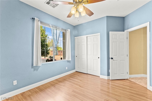 9685 Stonily Ln, Las Vegas, NV 89178 - unfurnished bedroom featuring wood finished floors, a closet, and a ceiling fan