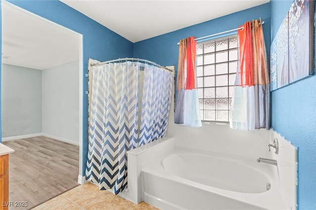 9685 Stonily Ln, Las Vegas, NV 89178 - full bath with a garden tub, plenty of natural light, vanity, and a shower with curtain