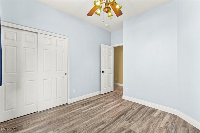 9685 Stonily Ln, Las Vegas, NV 89178 - unfurnished bedroom featuring wood finished floors, a closet, and a ceiling fan