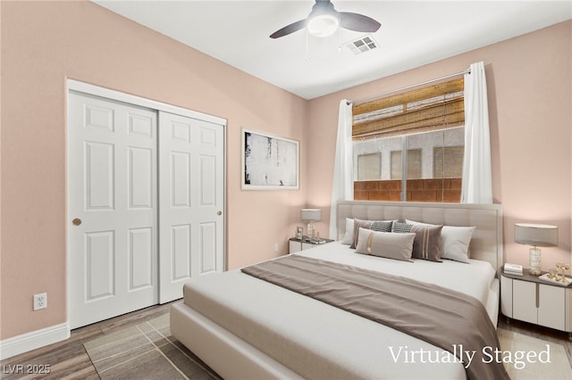 9685 Stonily Ln, Las Vegas, NV 89178 - bedroom featuring wood finished floors, a closet, and a ceiling fan