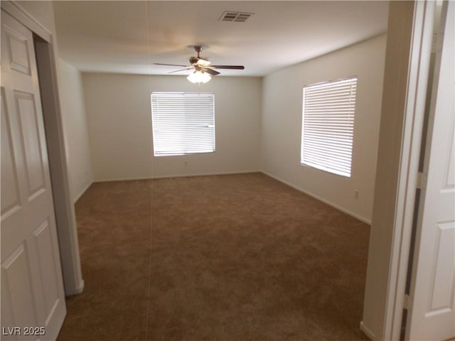 1018 Sun Poppy Ave, Las Vegas, NV 89123 - carpeted empty room featuring plenty of natural light and a ceiling fan