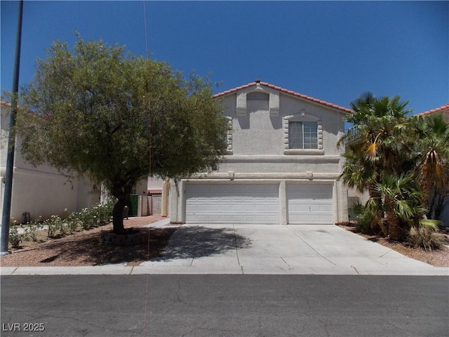 1018 Sun Poppy Ave, Las Vegas, NV 89123 - mediterranean / spanish home with an attached garage, stucco siding, concrete driveway, and a tile roof