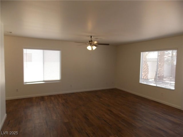 1018 Sun Poppy Ave, Las Vegas, NV 89123 - spare room with plenty of natural light, dark wood-style floors, and a ceiling fan