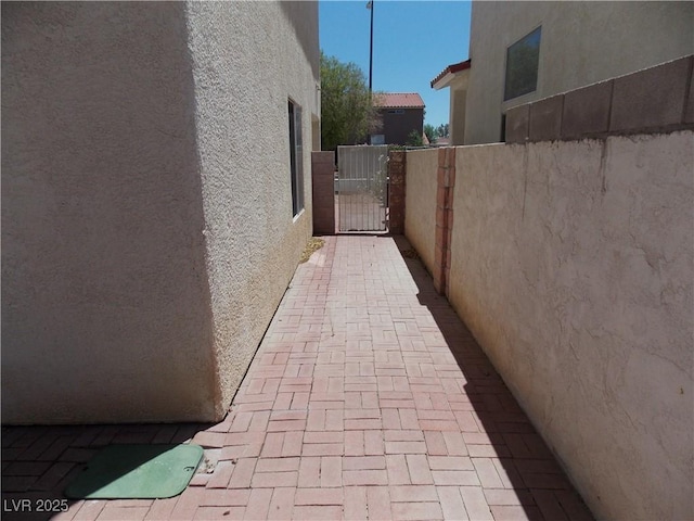 1018 Sun Poppy Ave, Las Vegas, NV 89123 - view of home's exterior featuring stucco siding and a gate
