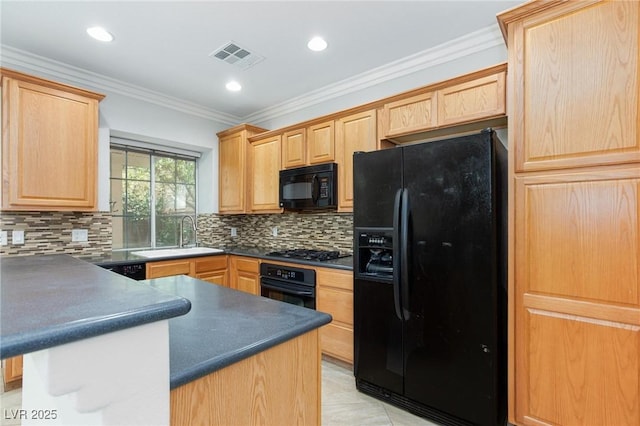 9814 Gifthouse St, Las Vegas, NV 89178 - kitchen featuring black appliances, light brown cabinets, dark countertops, backsplash, and a peninsula