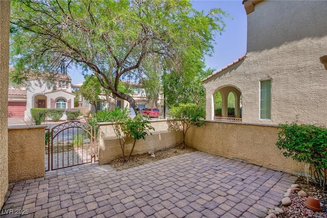 9814 Gifthouse St, Las Vegas, NV 89178 - view of patio featuring a gate