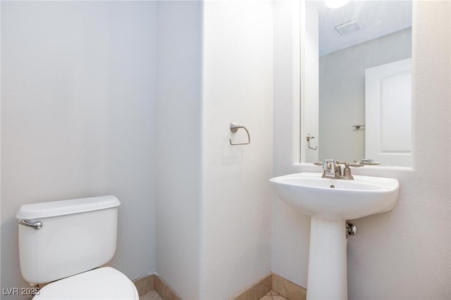 9814 Gifthouse St, Las Vegas, NV 89178 - half bath with toilet and tile patterned floors