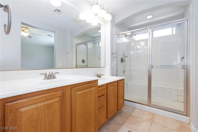 9814 Gifthouse St, Las Vegas, NV 89178 - full bathroom featuring tile patterned floors, a shower stall, double vanity, and a ceiling fan