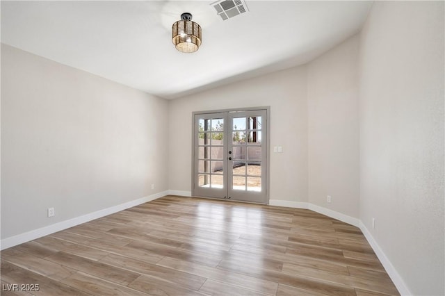 5004 Celebrity Cir, Las Vegas, NV 89119 - empty room featuring lofted ceiling, french doors, and light wood-style floors