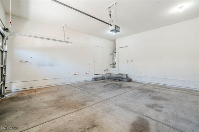 5282 Monterey Park Cir, Las Vegas, NV 89146 - garage featuring a garage door opener and water heater
