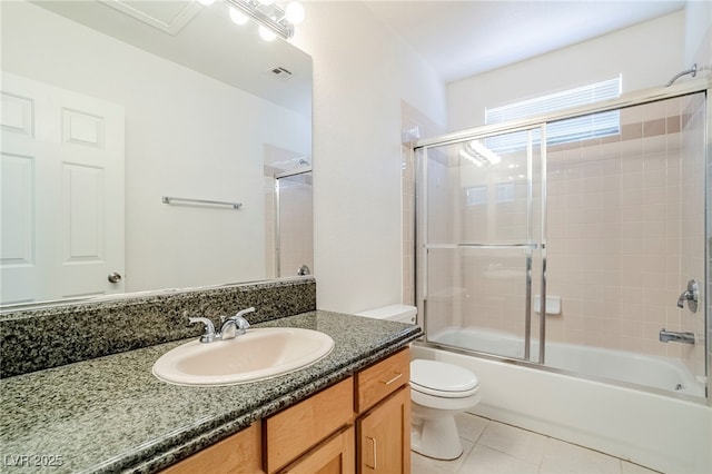 5282 Monterey Park Cir, Las Vegas, NV 89146 - bathroom with tile patterned floors, vanity, and bath / shower combo with glass door