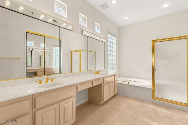 10548 Findlay Ave, Las Vegas, NV 89134 - full bathroom featuring a garden tub, a shower stall, double vanity, tile patterned flooring, and recessed lighting