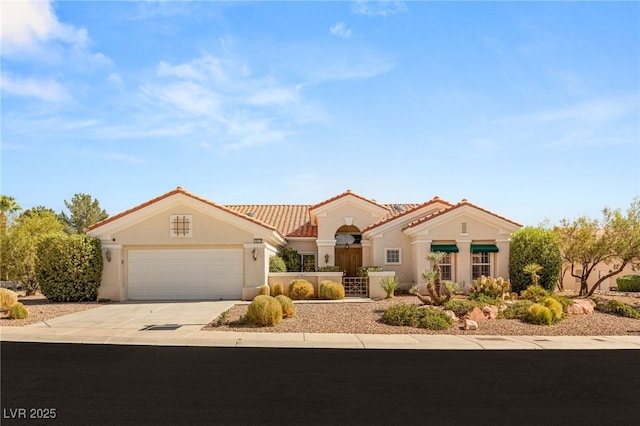 10548 Findlay Ave, Las Vegas, NV 89134 - mediterranean / spanish-style house with driveway, stucco siding, an attached garage, and a tiled roof