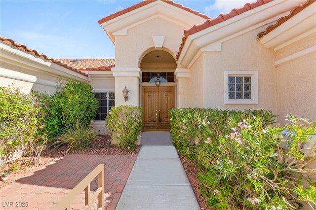 10548 Findlay Ave, Las Vegas, NV 89134 - doorway to property featuring a tile roof and stucco siding
